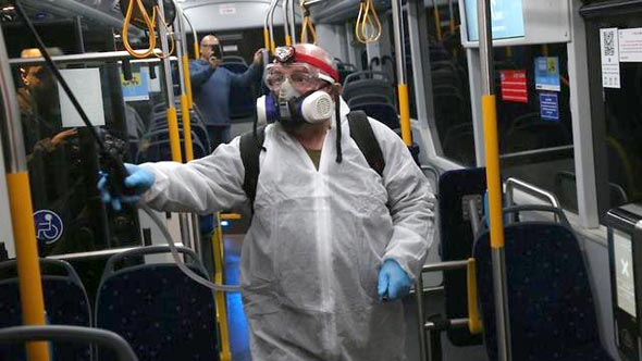 A bus in Israel getting disinfected. Photo: Motti Kimchi A bus in Israel getting disinfected. Photo: Motti Kimchi